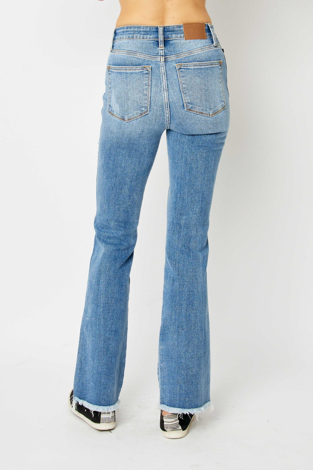 Judy Blue Full Size Distressed Raw Hem Bootcut Jeans - RebelReine Apparel & Co.